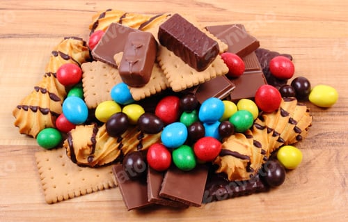 Preview: Heap Of Candies And Cookies On Wooden Table, Too Many Sweets, Concept Of Unhealthy Food And