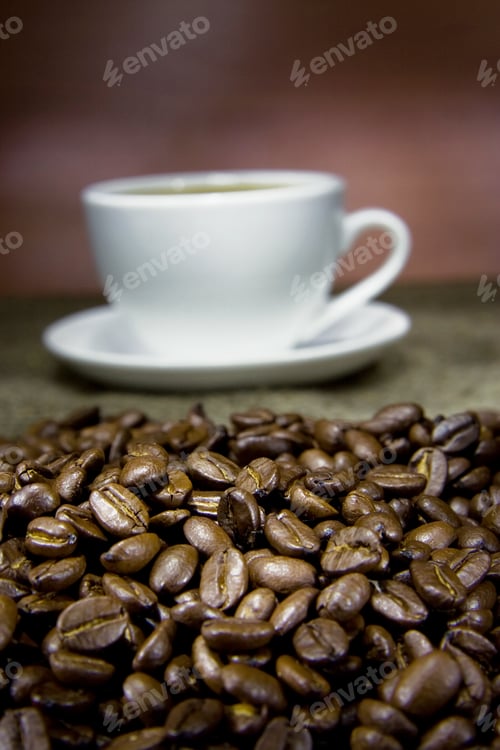 Preview: Cup Of Coffee And Beans On Sack In Night
