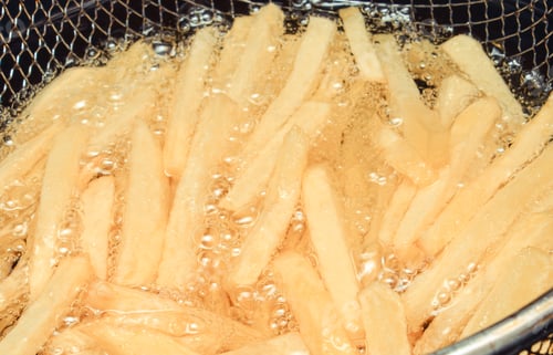 Preview: French Fries Fried In Oil. Unhealthy And Caloric Eating Concept