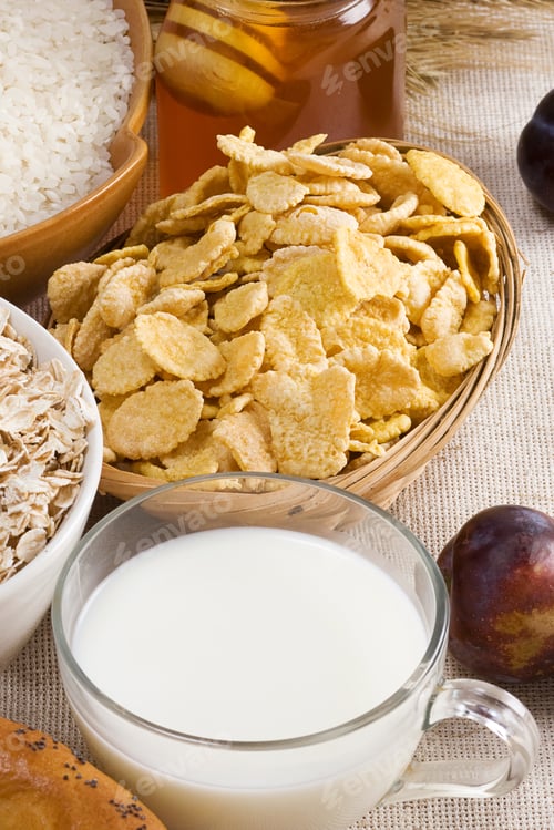 Preview: Oat Flake And Corn Cereals In Plate On Sack Background