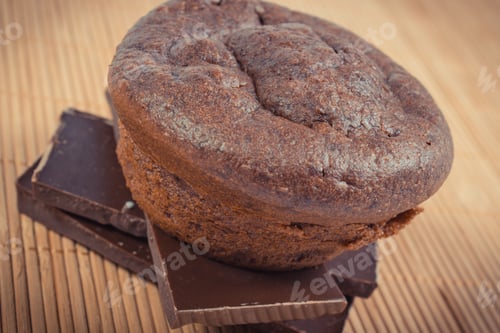 Preview: Fresh Baked Homemade Chocolate Muffins On Wooden Background. Delicious Dessert