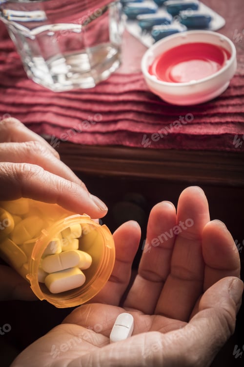 Preview: Women Take White Capsule With Left Hand From A Ambar Bottle