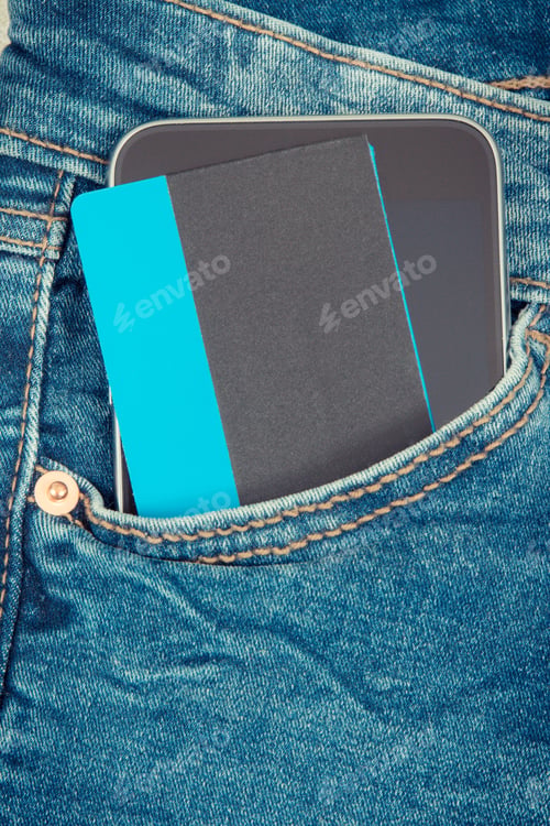 Preview: Credit Card With Mobile Phone In Front Jeans Pocket. Concept Of Cashless Paying For Shopping