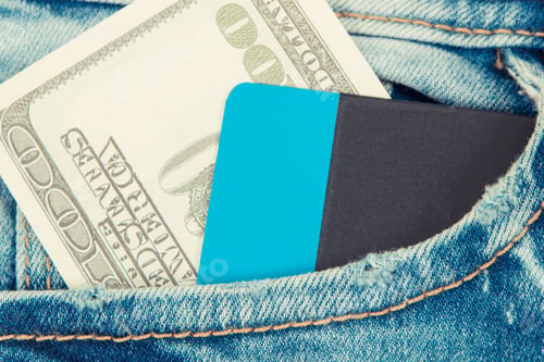 Preview: Currencies Dollar And Credit Card In Front Jeans Pocket. Concept Of Choice Between Cashless Or Cash