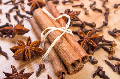 Preview: Star Of Anise, Cinnamon Sticks And Cloves Lying On Wooden Table, Seasoning For Cooking And Baking