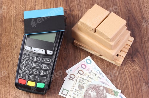 Preview: Payment Terminal With Contactless Credit Card, Polish Currency Money And Small Wrapped Boxes On