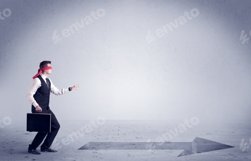 Preview: A Confused Blind Salesman Standing In Front Of A Drawn Arrow On The Floor Pointing In The Right