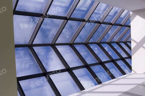 Preview: Skylight With Reflections And Blue Sky