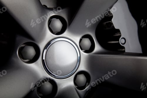 Preview: Picture Of A Black Car Tire With Focus On Nuts