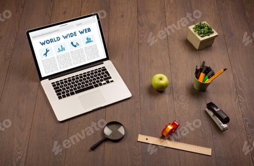 Preview: Laptop Computer On Wooden Desk With Office Suplies