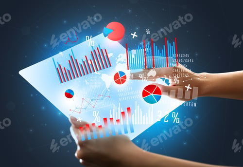 Preview: Young Female Hand Holding A Tablet With Red And Blue Charts