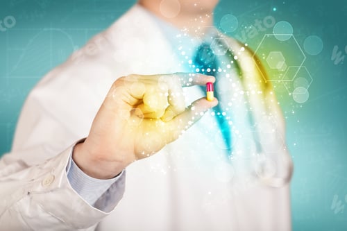 Preview: A Male Doctor In White Coat With A Stethoscope Holding A Pill With Glowing Colorful Dots And Lines