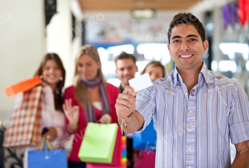 Preview: Group Of People At A Shopping Center - Man Displaying A Card