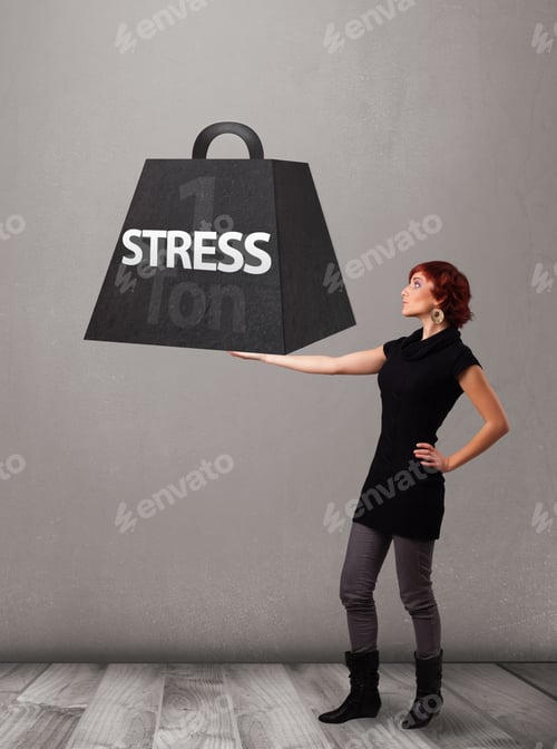 Preview: Attractive Young Woman Holding One Ton Of Stress Weight