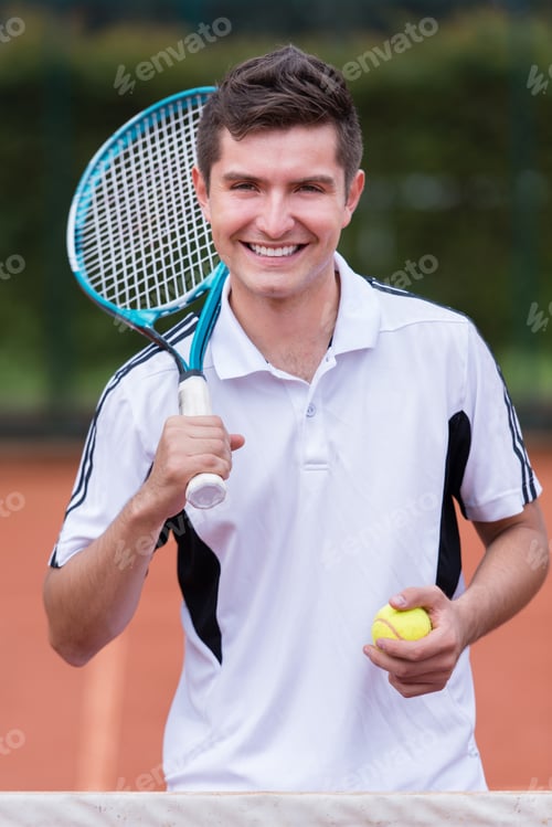 Preview: Happy Male Tennis Player Smiling At The Court