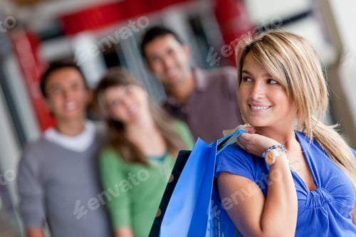 Preview: Happy Woman With Her Friends Behind Her Smiling In A Mall