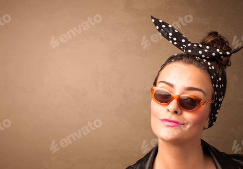 Preview: Portrait Of A Young Pretty Woman With Sunglasses And Copyspace On Brown Background