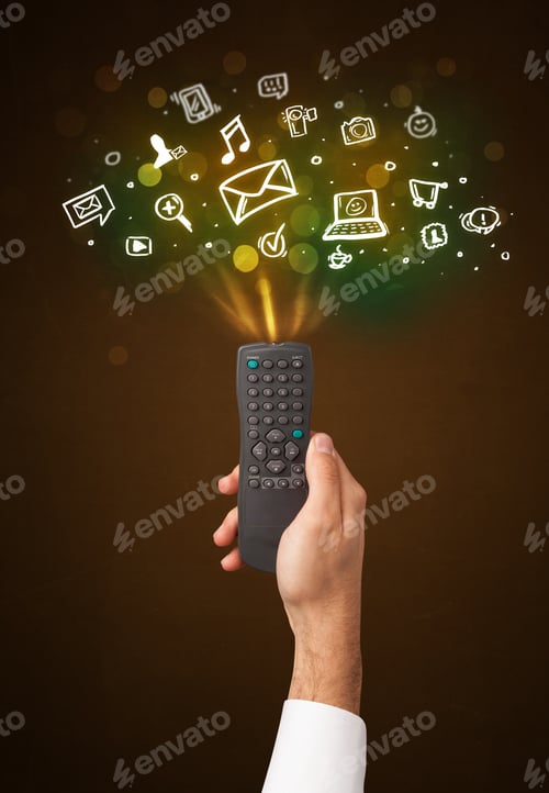 Preview: Hand Holding A Remote Control, Social Media Icons Coming Out Of It