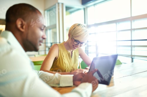 Preview: Two Creative Millenial Small Business Owners Working On Social Media Strategy Using A Digital