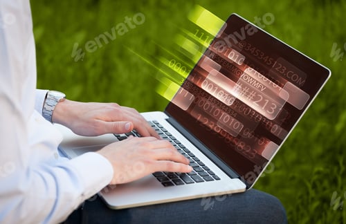 Preview: Close Up Of Man Typing On Laptop Computer With Glowing Technology Effect