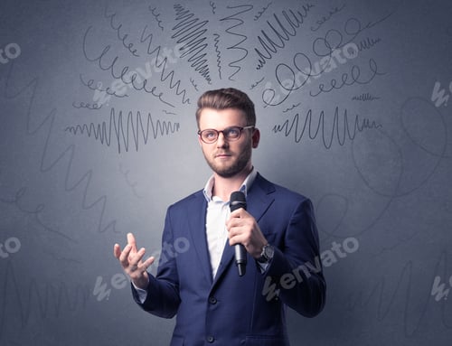 Preview: Businessman Speaking Into Microphone With Scribbles Over His Head