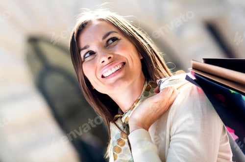 Preview: Female Shopper Holding Shopping Bags And Looking Happy