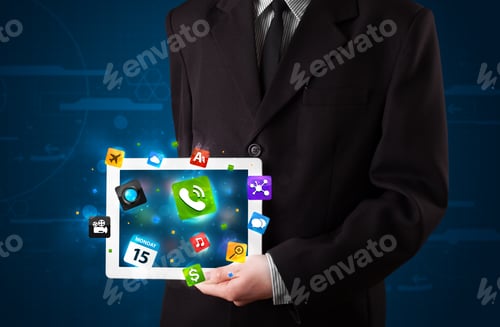 Preview: Young Businessman Holding A Tablet With Modern Colorful Apps And Icons