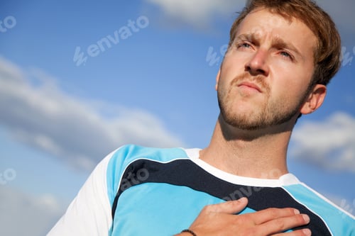 Preview: Man Outdoors With His Hand On Heart Taking An Oath