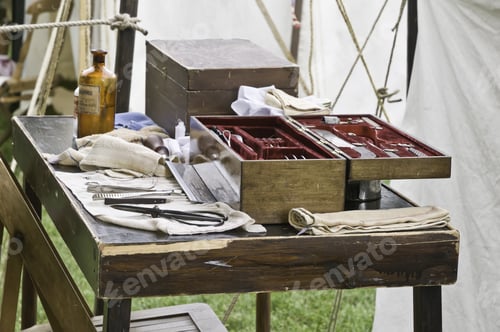 Preview: Instrument Table In Surgeons'S Tent, With Bottle Of Chloroform And Amputation Saw, At Reenactment
