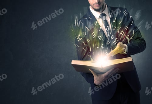 Preview: Businessman Holding Book With Letter Concept.