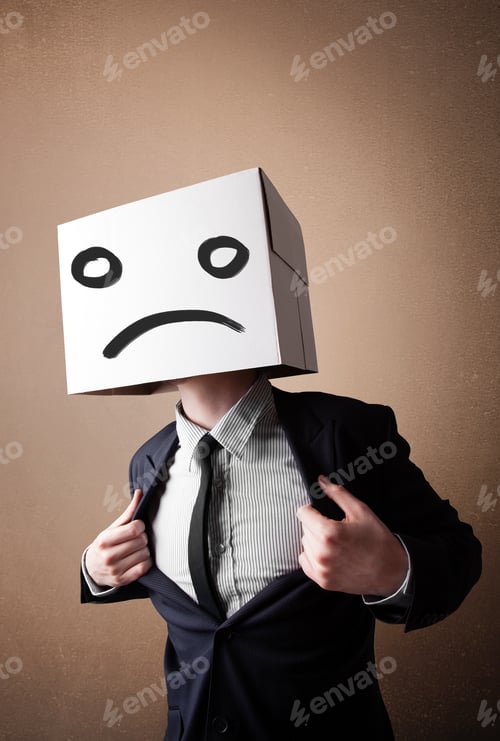Preview: Businessman Standing And Gesturing With A Cardboard Box On His Head With Sad Face