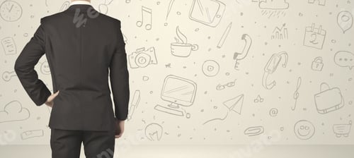 Preview: Businessman From The Back In Front Of An Social Media Icon Wall