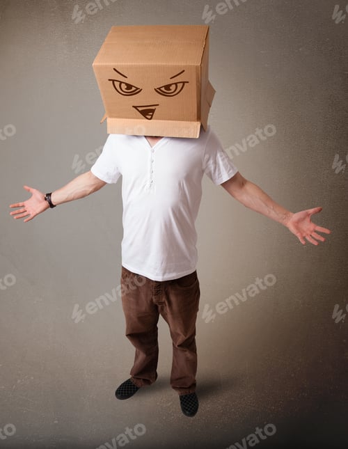 Preview: Young Man Standing And Gesturing With A Cardboard Box On His Head With Evil Face