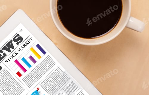 Preview: Workplace With Tablet Pc Showing Latest News And A Cup Of Coffee On A Wooden Work Table Close-Up