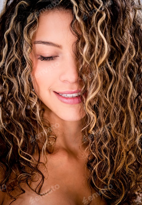 Preview: Portrait Of A Beautiful Woman With Curly Hair