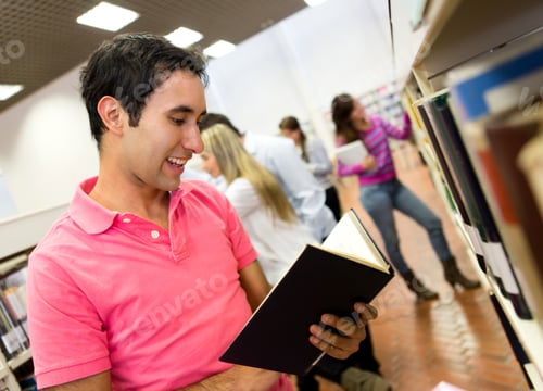 Preview: Casual Man At The Library Reading A Book