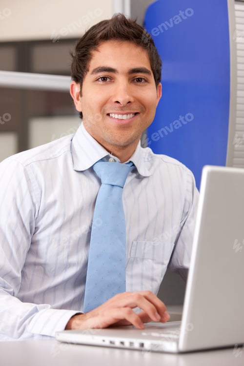 Preview: Business Man Looking Happy On A Laptop In An Office