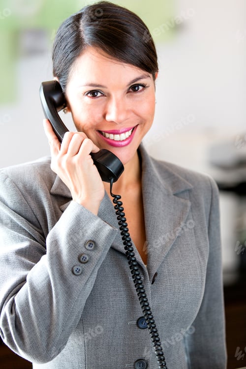 Preview: Successful Businesswoman Talking On The Phone At The Office
