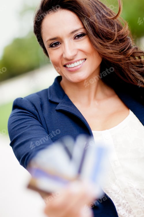 Preview: Latin Woman Holding Credit Cards - Financial Solutions