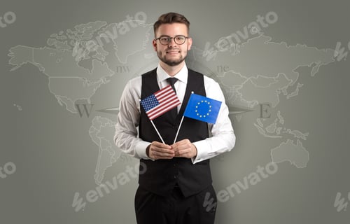 Preview: Cheerful Businessman Standing In Front Of A Map With Flag On His Hand