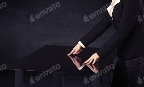 Preview: Close Up Of A Hand Touching Smart Table With Copy Space On Black Background