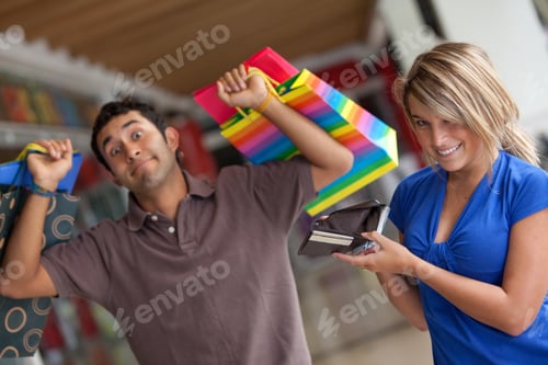Preview: Shopping Woman Emptying A Man'S Wallet At A Mall
