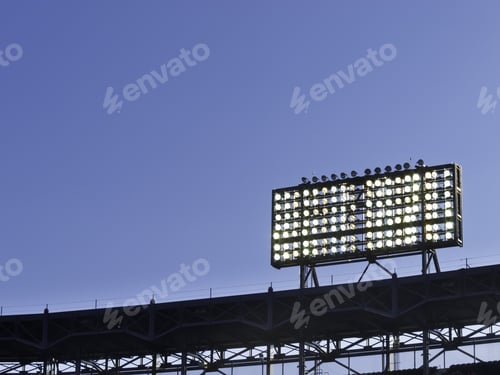 Preview: Floodlights Over Baseball Stadium At Dusk, With Copy Space