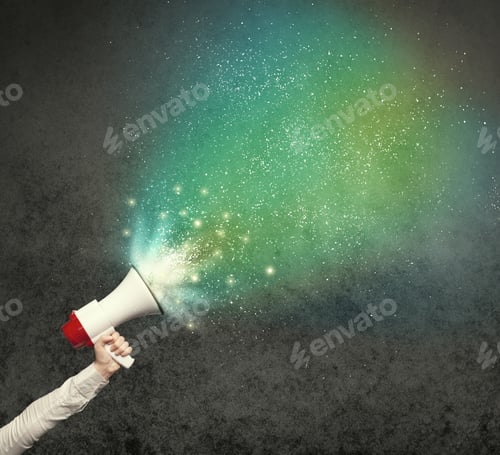Preview: Caucasian Business Hand Holding Megaphone With White Sparkles On A Grunge Background