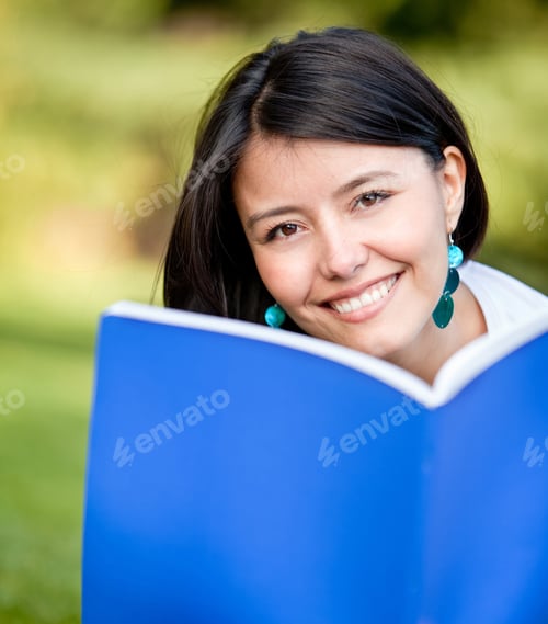 Preview: Portrait Of A Female Student Outdoors With A Notebook