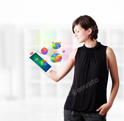 Preview: Young Business Woman Looking At Modern Tablet With Colourful Pie Charts