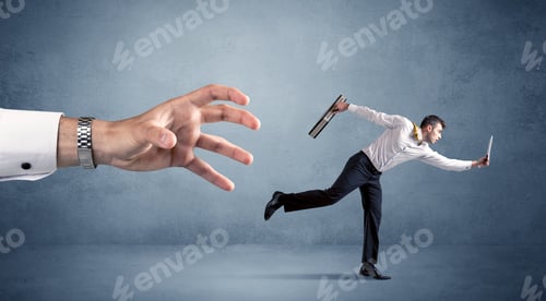 Preview: Young Miniature Businessman Running From A Big Hand