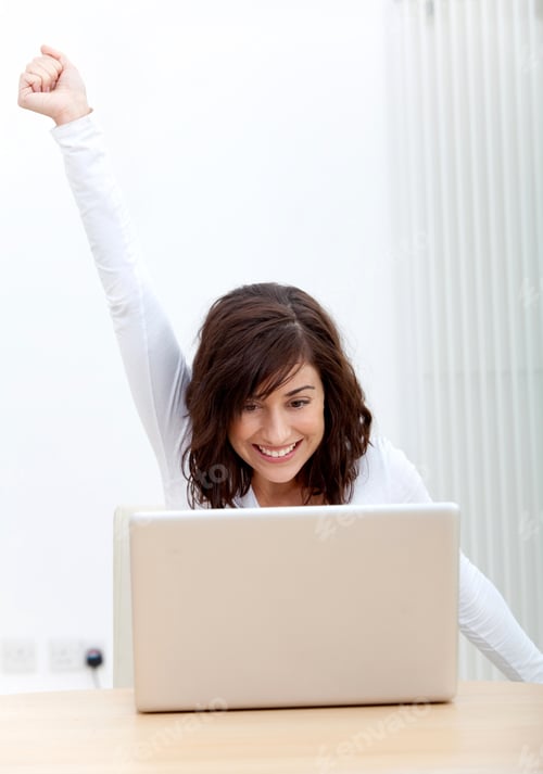 Preview: Happy Woman Working On A Laptop With Arms Outstretched And Smiling