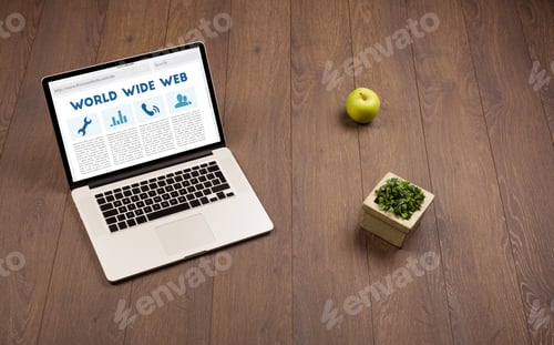Preview: Laptop Computer On Wooden Desk With Office Suplies