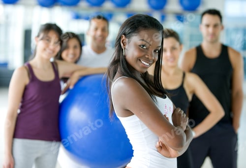 Preview: Beautiful Black Woman Smiling At The Gym With Her Friends Behind Her